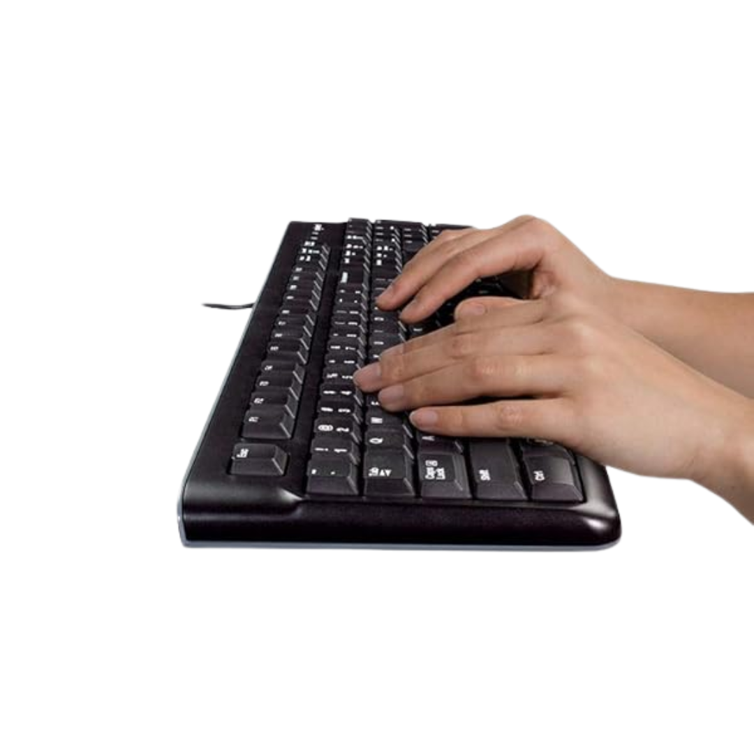 Person typing on a black keyboard with a white background