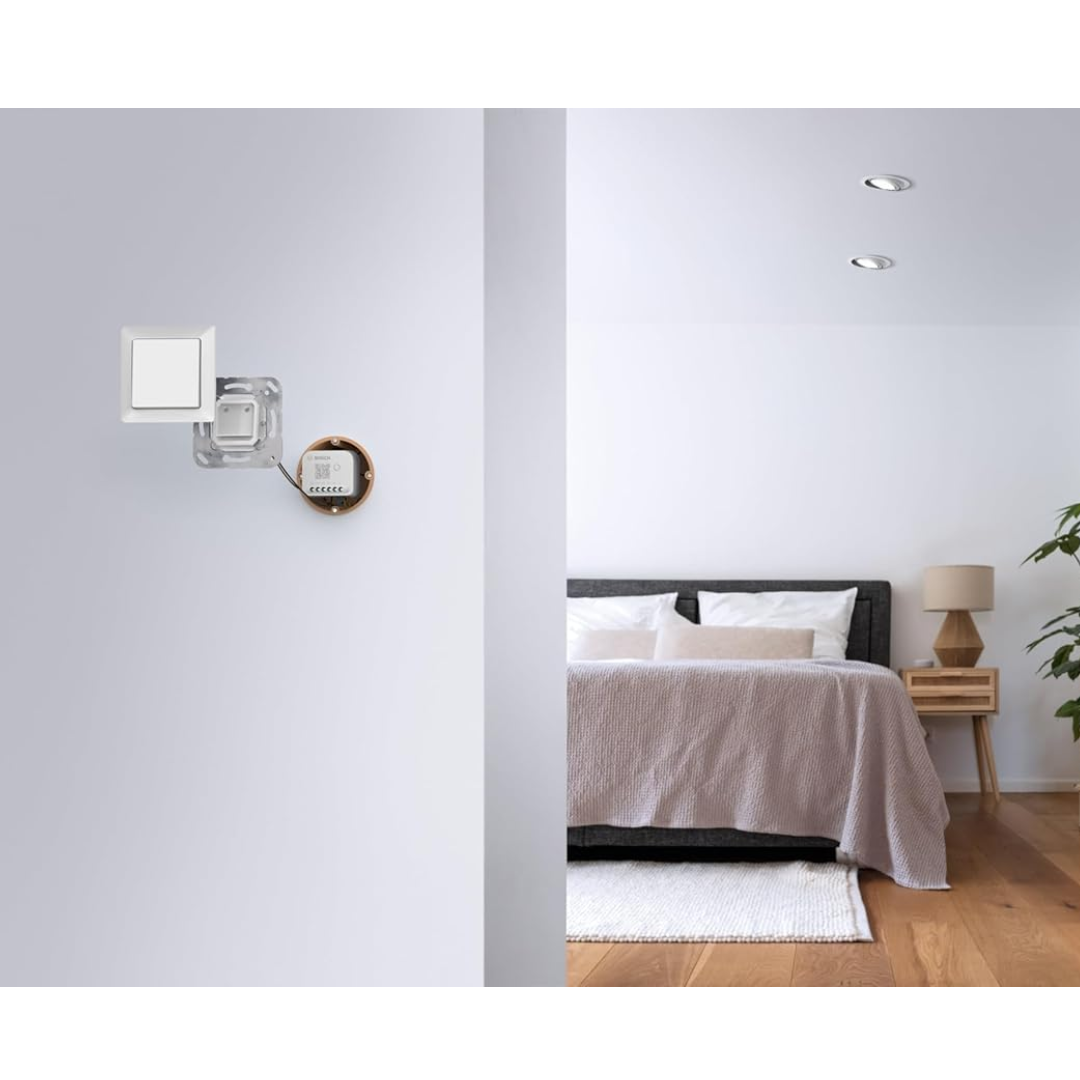 Modern bedroom with bed, nightstands, and wall sconces.