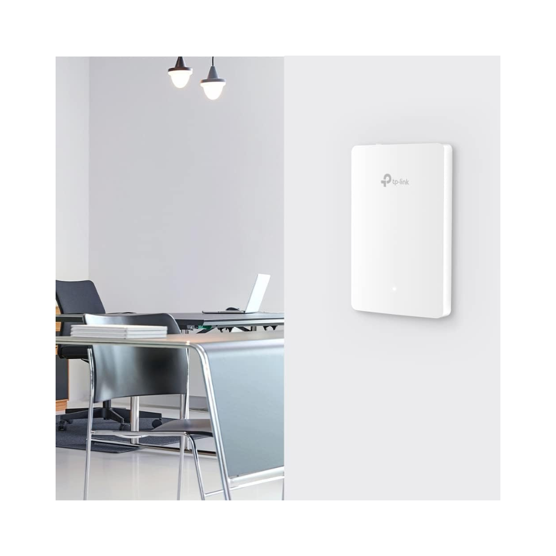 White network device on a wall in an office setting
