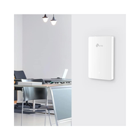 White network device on a wall in an office setting