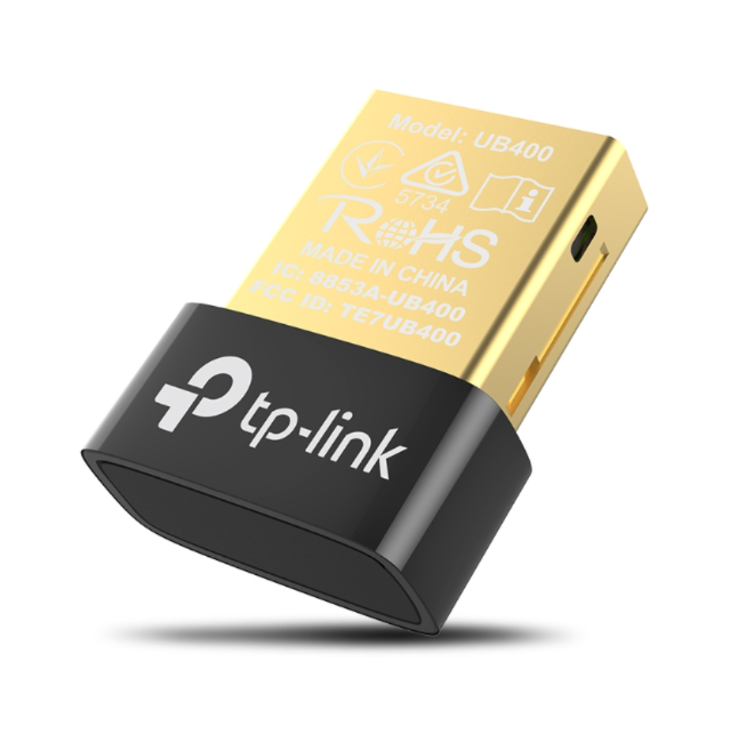 TP-Link USB adapter with gold top and black bottom on a white background