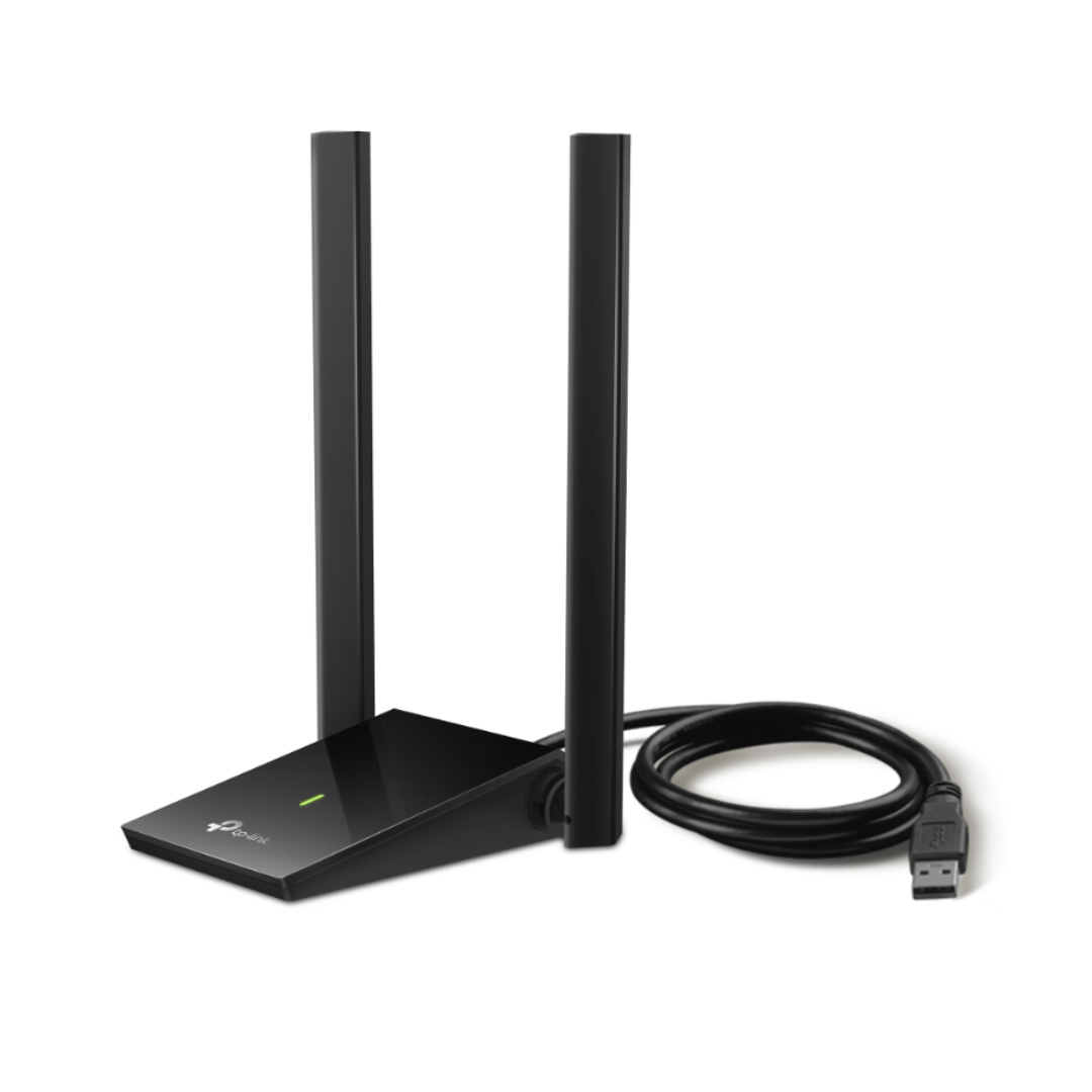 Black wireless router with antennas and USB cable on a white background