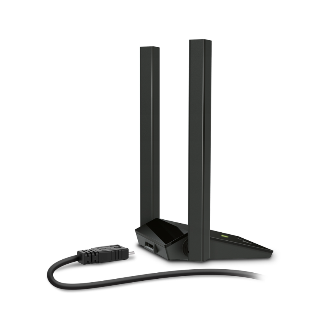 Black wireless router with antennas on a white background