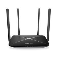 Black router with four antennas on a white background