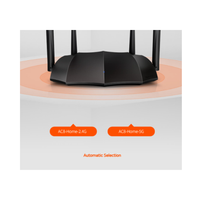 Black router with antennas on a white background