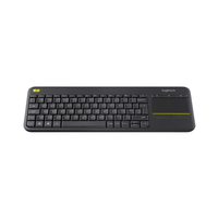 Black keyboard with touchpad on a white background