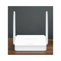 White wireless router with antennas on a wooden surface and dark background