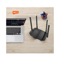 Black router on a wooden desk with a laptop and markers in the background