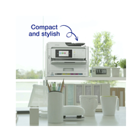 White printer on a desk with a window view, labeled 'Compact and stylish'.