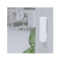 White cylindrical device with blue light on a blurred background