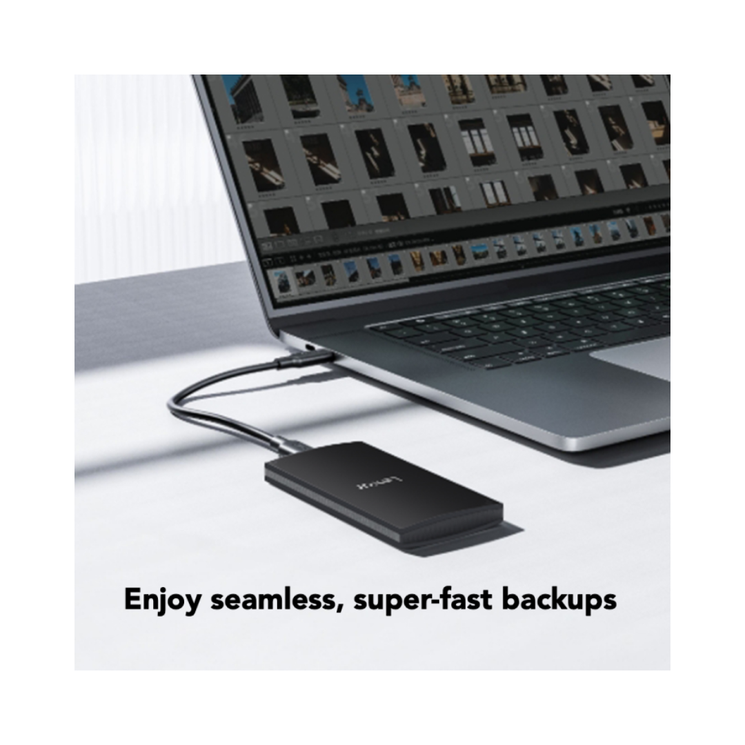 External hard drive connected to a laptop with text 'Enjoy seamless, super-fast backups'.