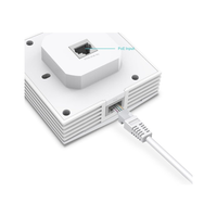 White network switch with Ethernet cable on a white background