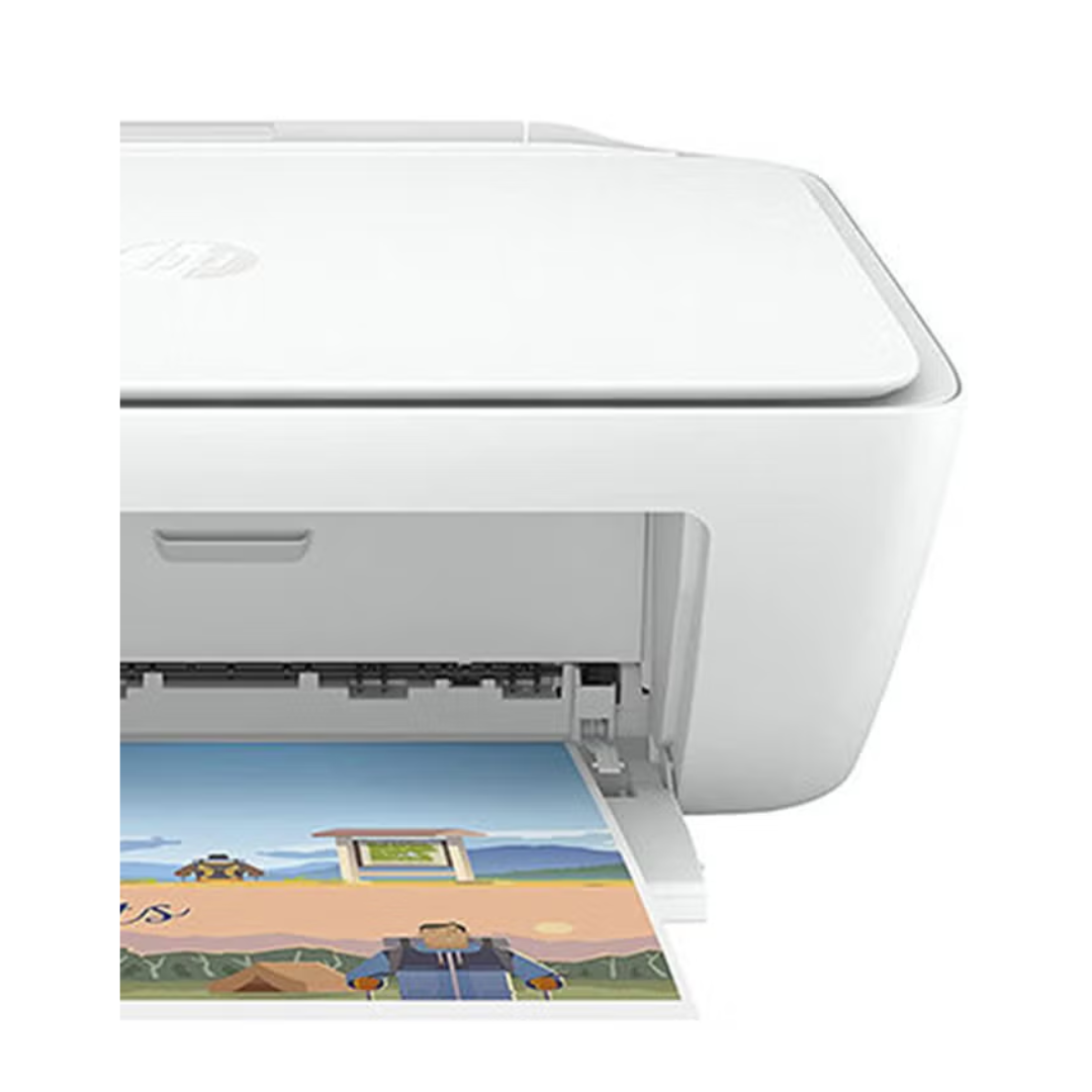 White printer with a printed picture of a beach scene on a white background