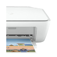White printer with a printed picture of a beach scene on a white background