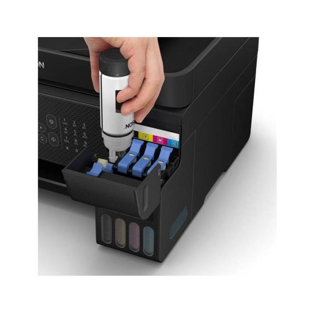 Person inserting ink cartridges into a printer with a close-up view of the process.