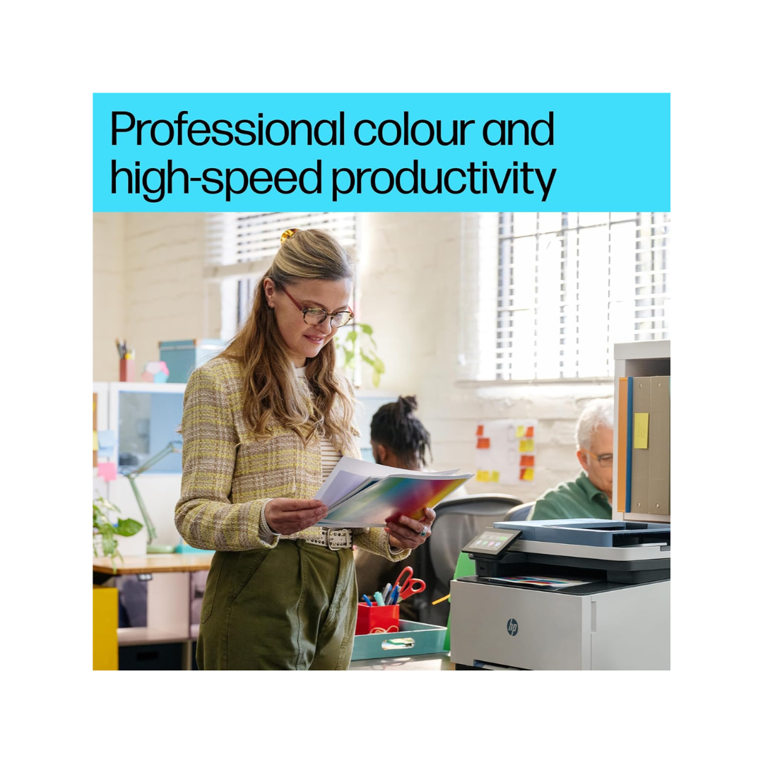 Woman in an office holding a colorful document with text about professional color and high-speed productivity.