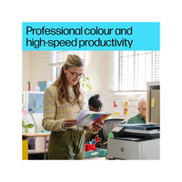 Woman in an office holding a colorful document with text about professional color and high-speed productivity.